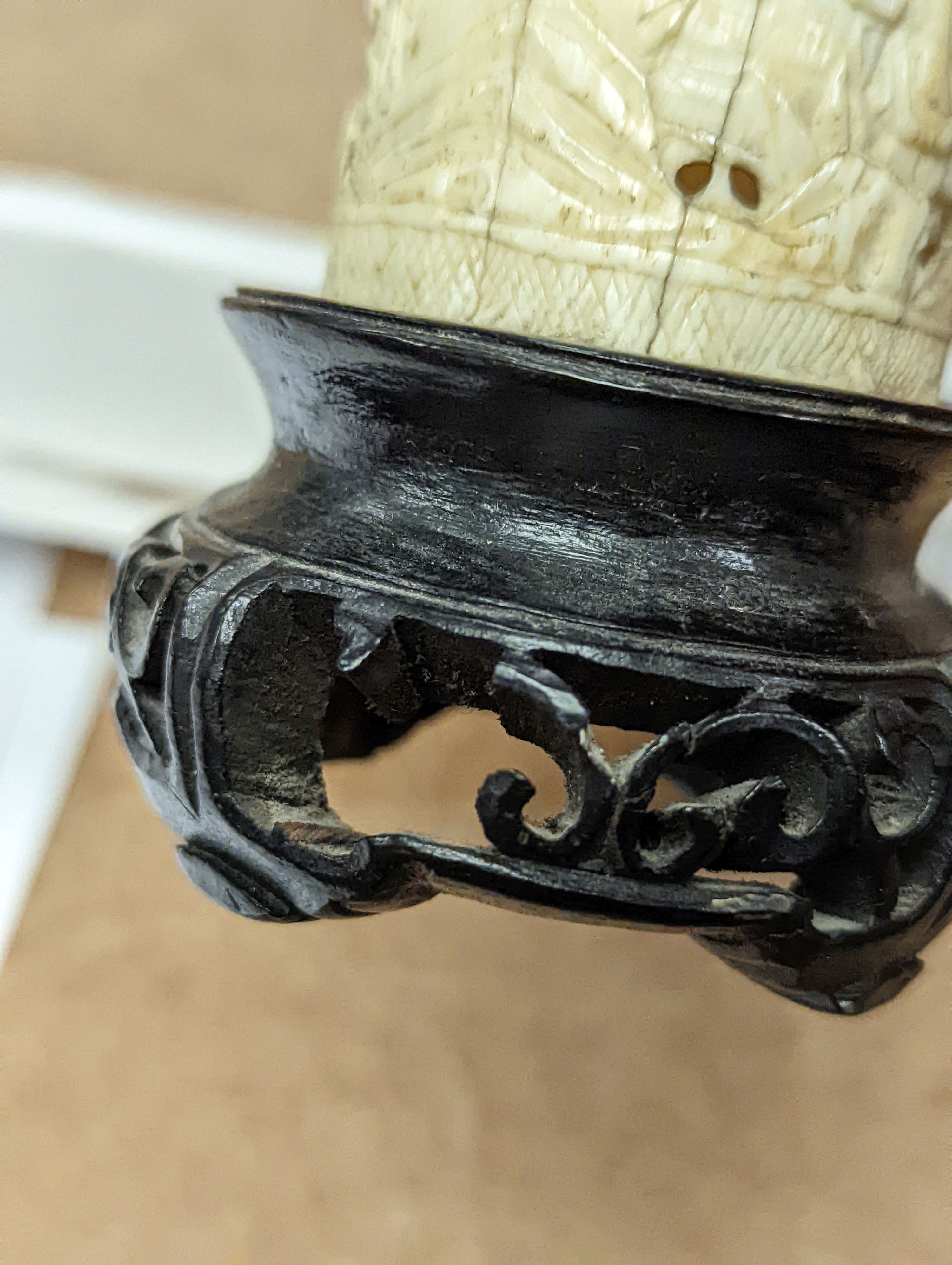 A pair of 19th century Chinese carved ivory brushpots on wooden stands - 12cm tall (including stands)